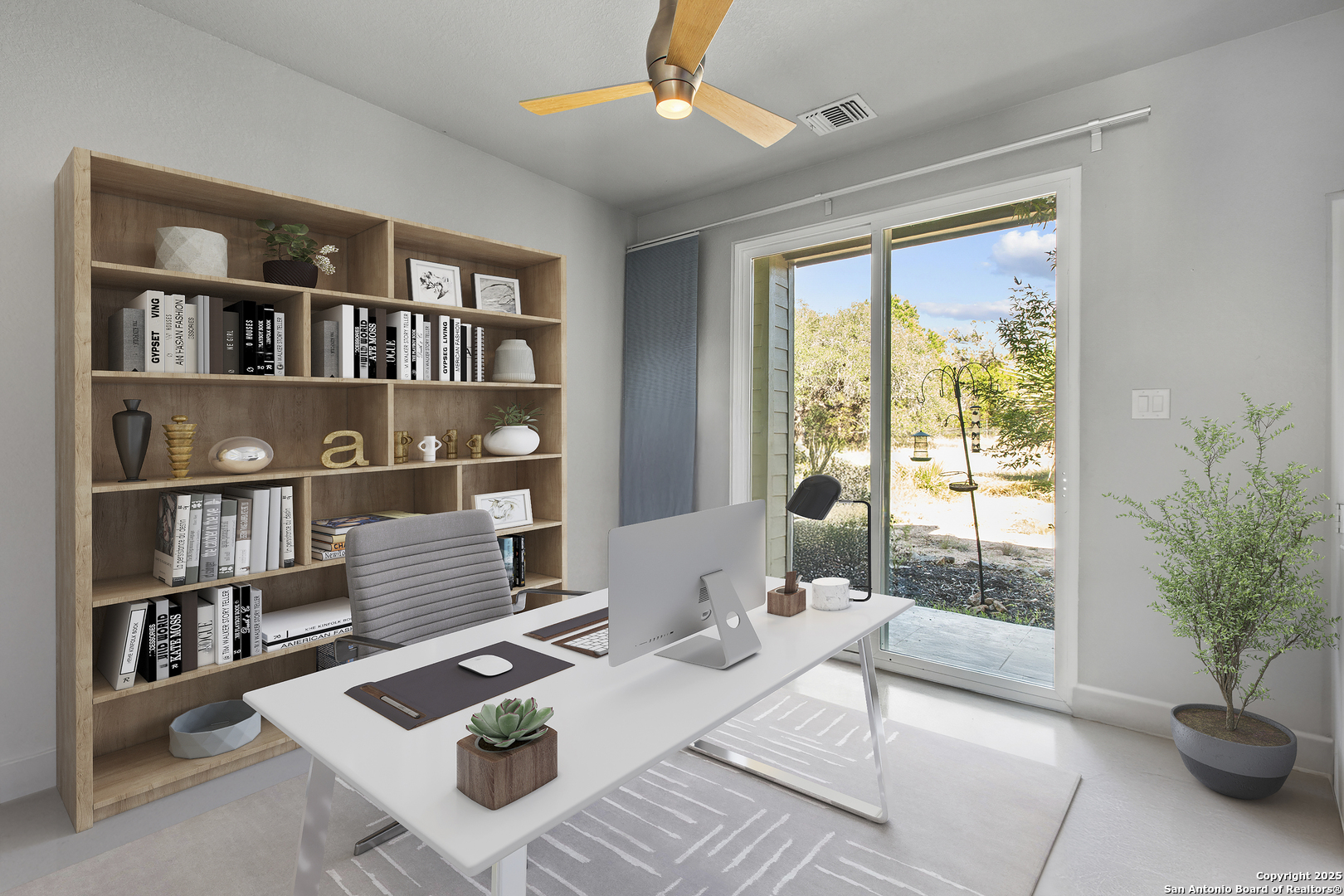 1280 Stoney Ridge Road Bulverde, TX 78163 - Photo 21 of 25 a living room with furniture a bookshelf and a window
