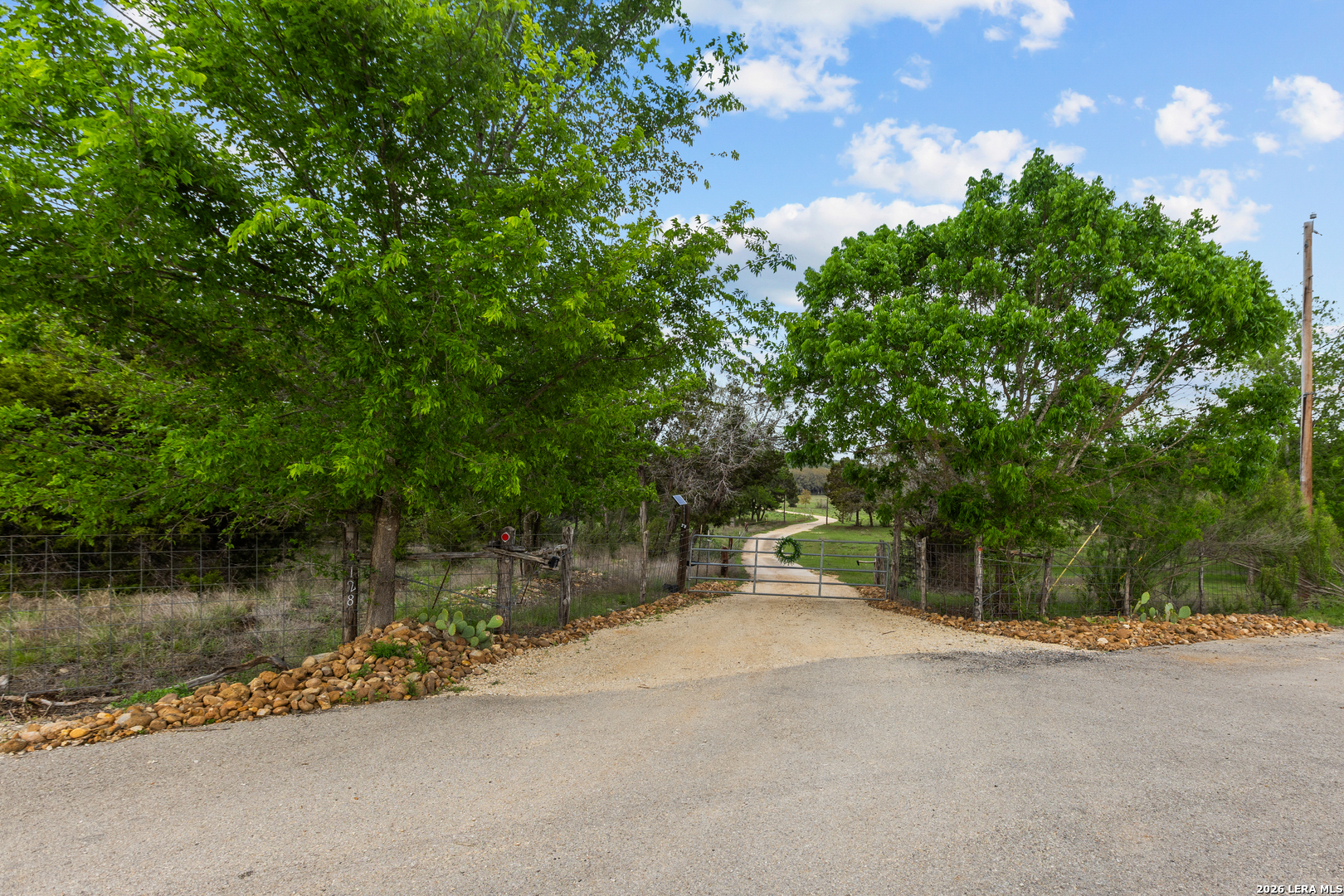 1280 Stoney Ridge Road Bulverde, TX 78163 - Photo 24 of 43 a backyard of a house with a lake view