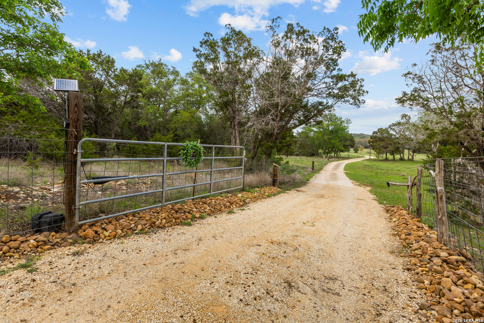 1280 Stoney Ridge Road Bulverde, TX 78163 - Photo 25 of 43 a view of a water fountain with large trees