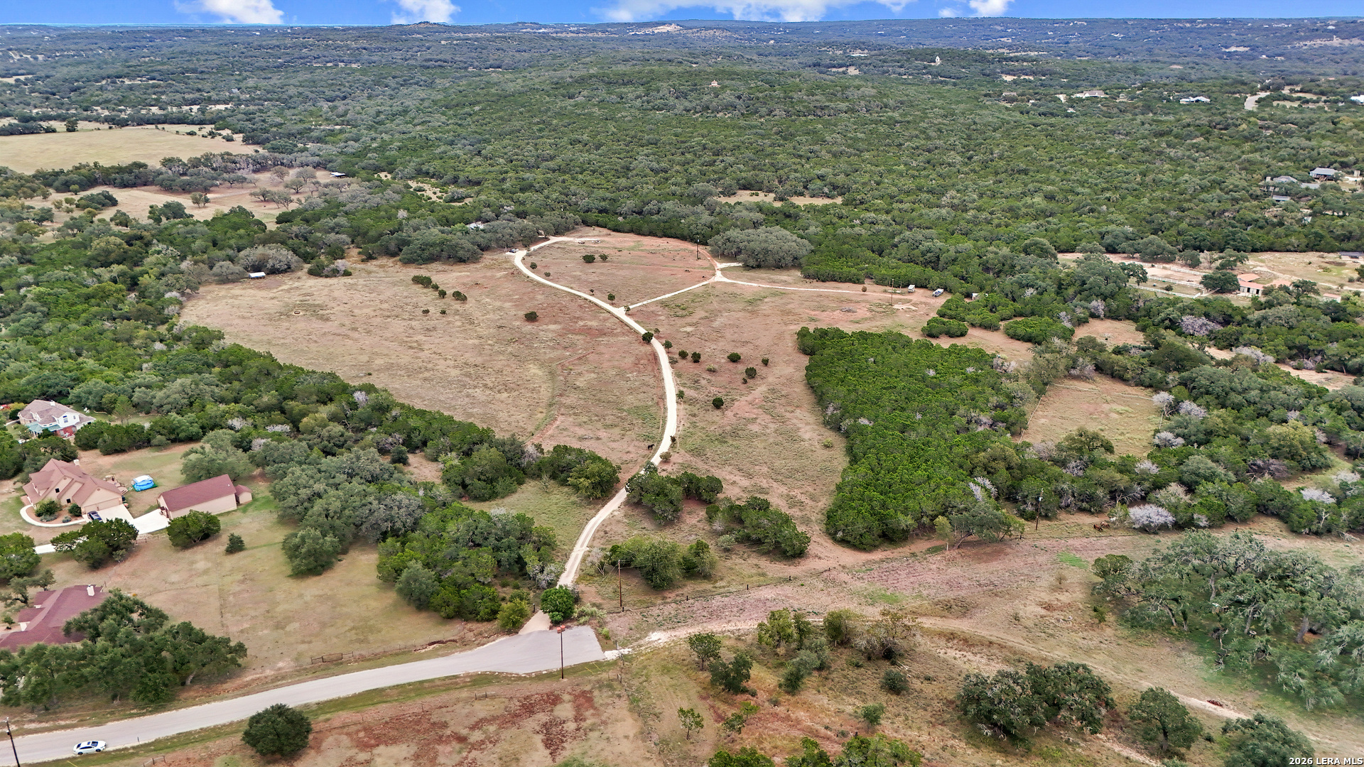 1280 Stoney Ridge Road Bulverde, TX 78163 - Photo 34 of 43 an aerial view of a house with a yard