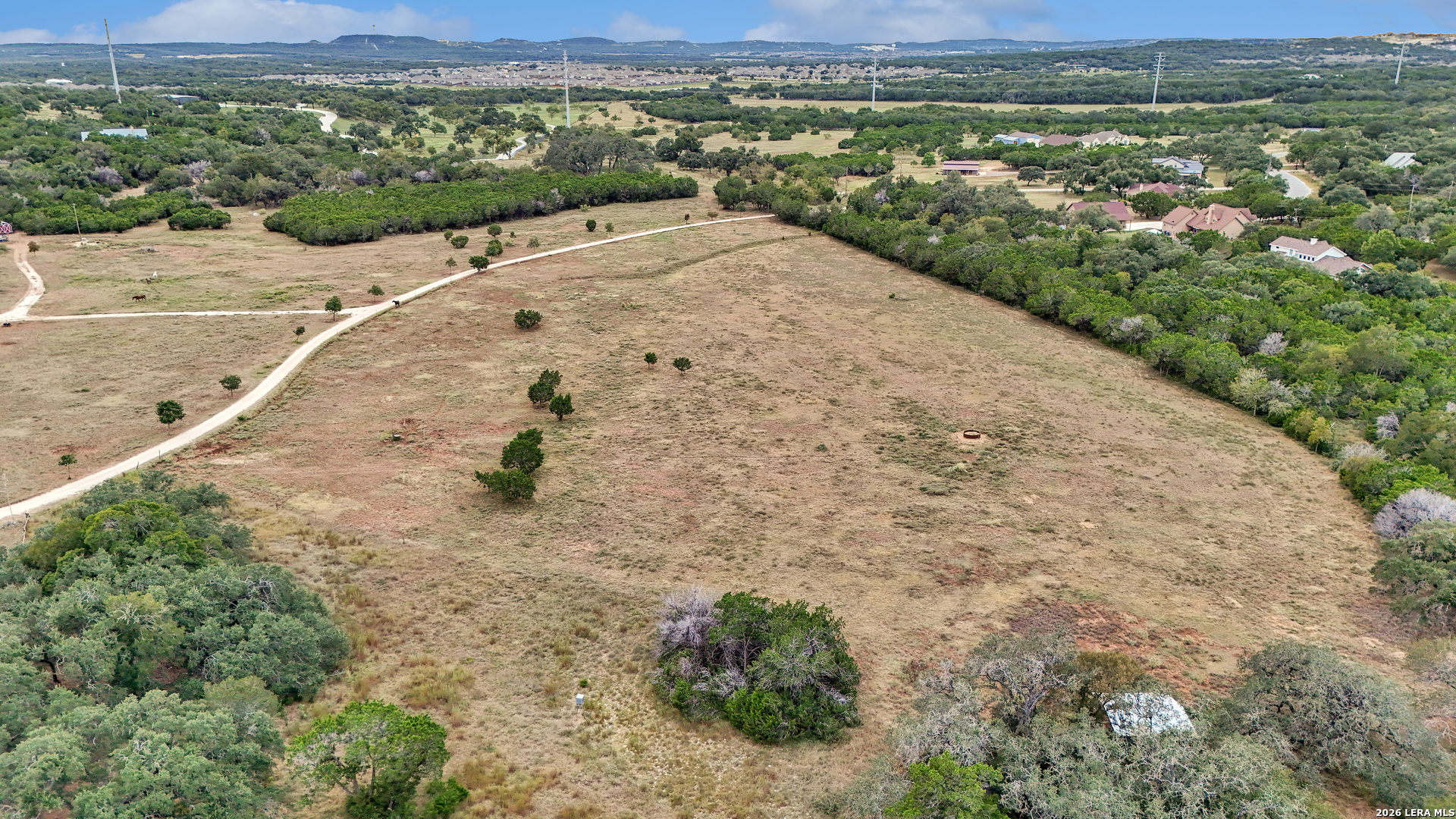 1280 Stoney Ridge Road Bulverde, TX 78163 - Photo 37 of 43 a view of a dry yard with wooden fence