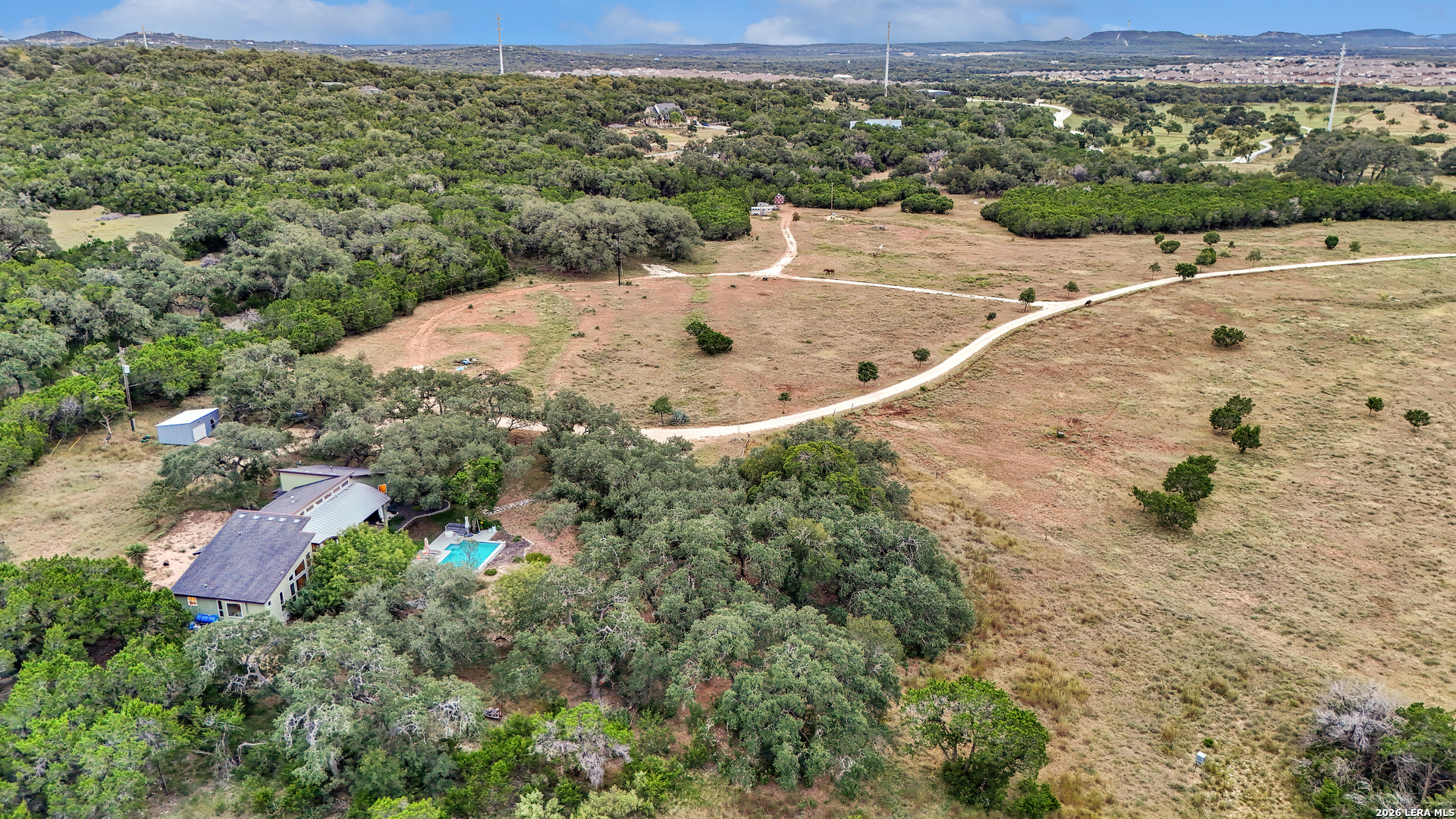 1280 Stoney Ridge Road Bulverde, TX 78163 - Photo 38 of 43 an aerial view of a house with a yard