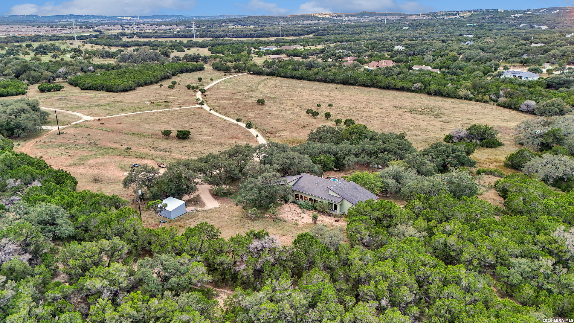 1280 Stoney Ridge Road Bulverde, TX 78163 - Photo 42 of 43 an aerial view of residential houses with outdoor space and trees
