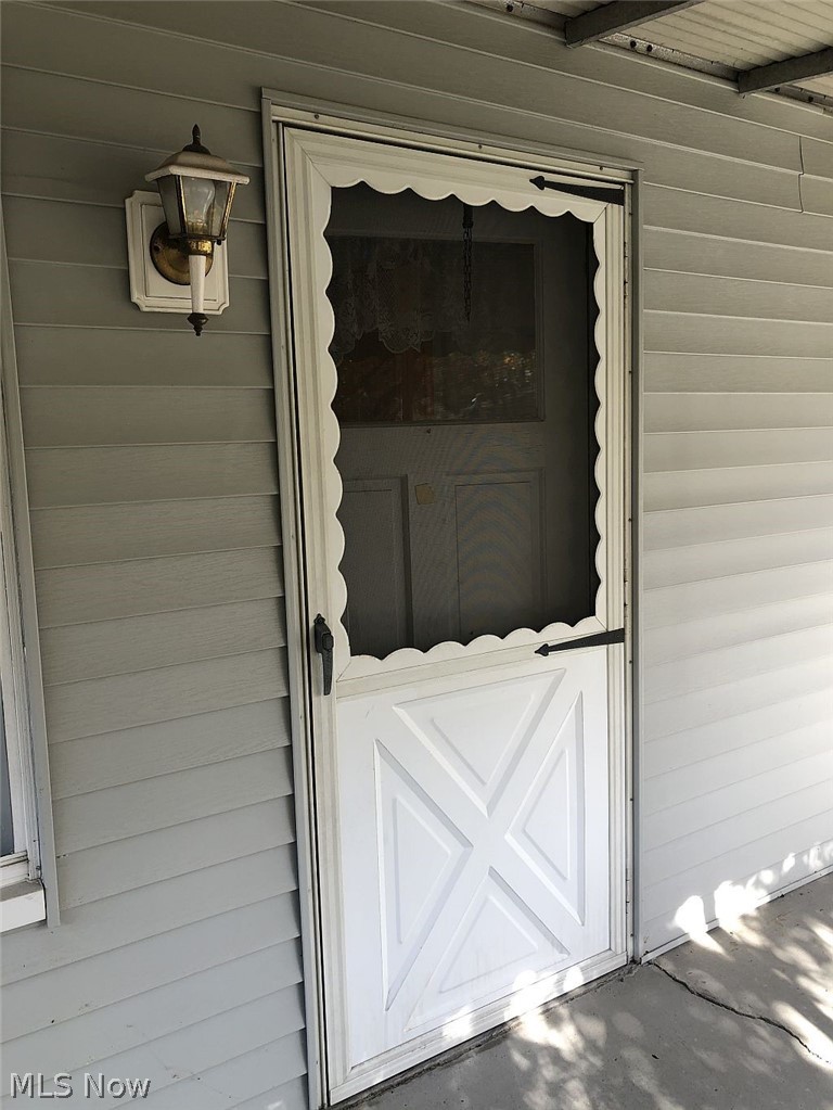 821 Reed Avenue Akron, OH 44306 - Photo 15 of 21 Front entry door is on the sunroom/porch .