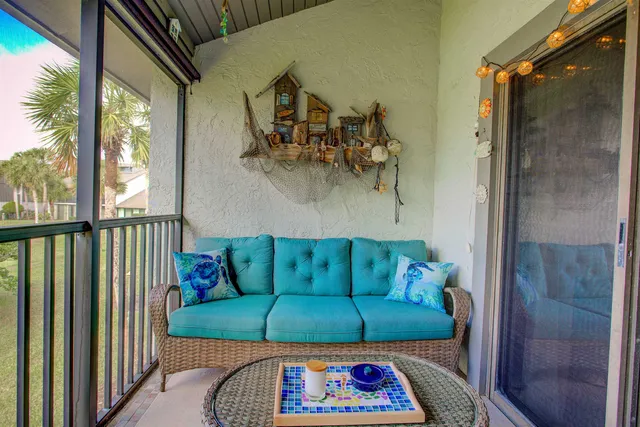 a living room with furniture and a gate