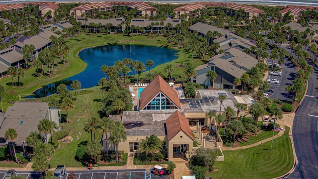 an aerial view of house with yard swimming pool and outdoor seating
