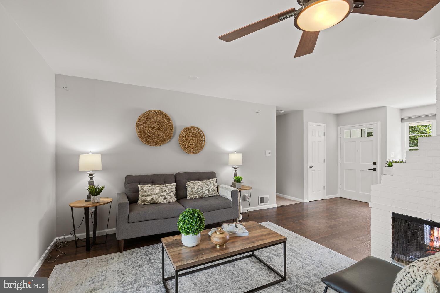 5333 Ravensworth Road Springfield, VA 22151 - Photo 19 of 38 Living room w fireplace + sliding doors to yard