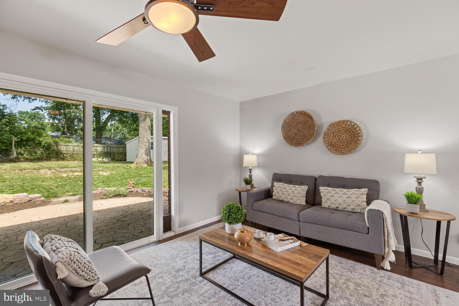 5333 Ravensworth Road Springfield, VA 22151 - Photo 20 of 38 Living room w fireplace + sliding doors to yard