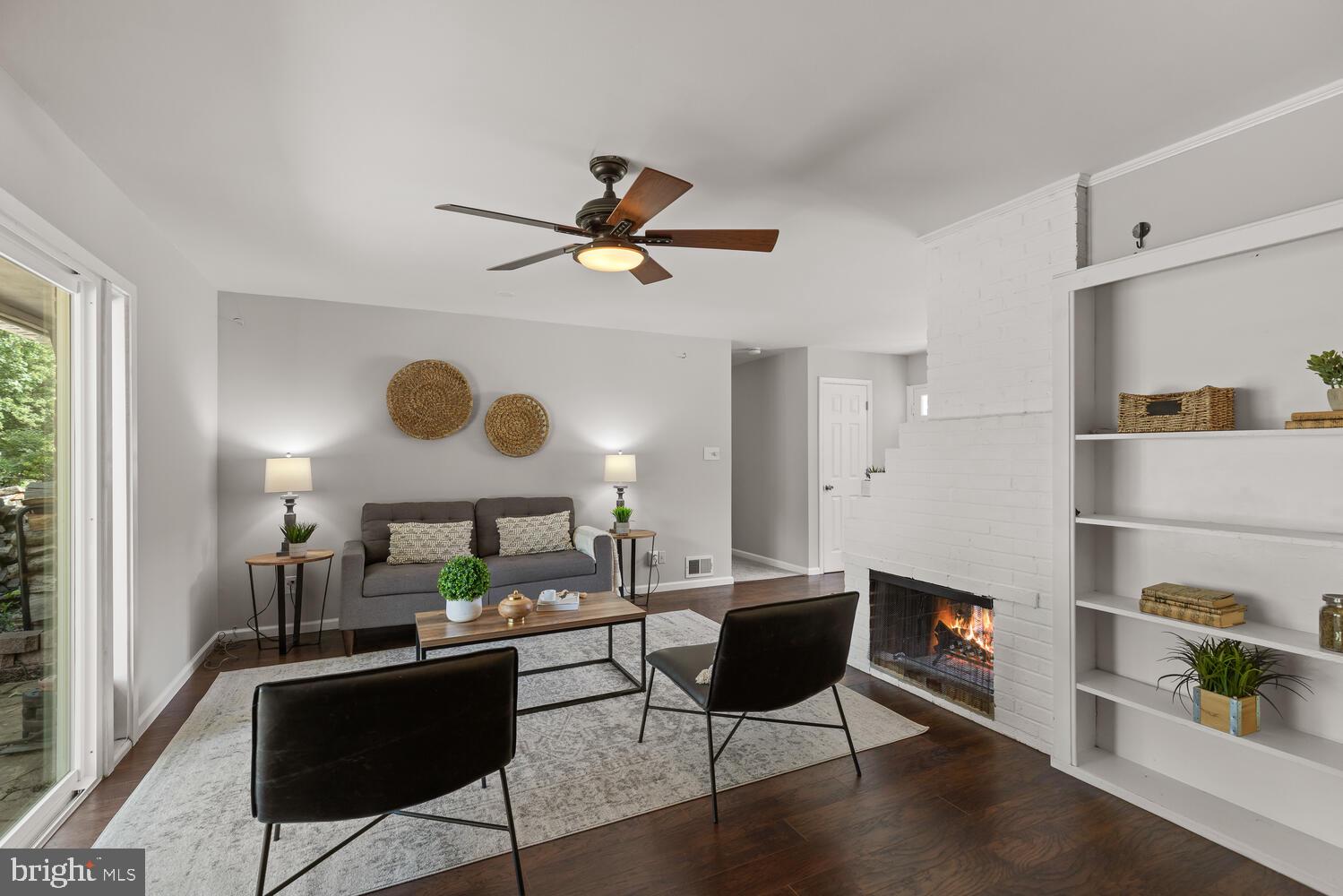 5333 Ravensworth Road Springfield, VA 22151 - Photo 21 of 38 Living room w fireplace + sliding doors to yard