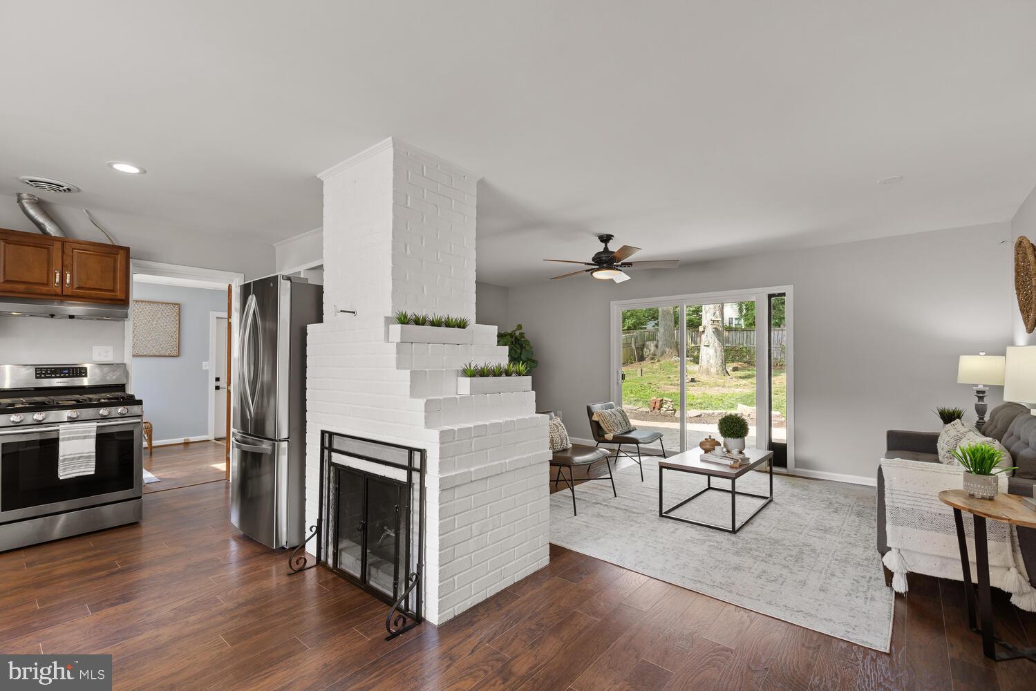 5333 Ravensworth Road Springfield, VA 22151 - Photo 10 of 38 Living room w fireplace + sliding doors to yard