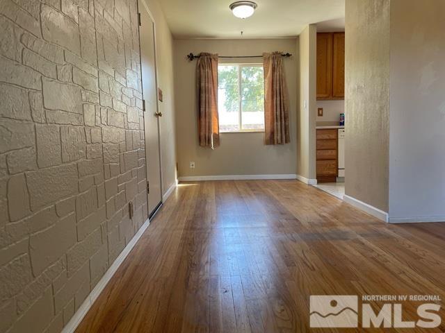 1650 Auburn Way Reno, NV 89502 - Photo 4 of 21 a view of livingroom with hardwood floor and window