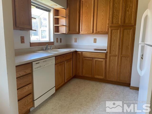 1650 Auburn Way Reno, NV 89502 - Photo 6 of 21 a kitchen with stainless steel appliances granite countertop a sink window and cabinets
