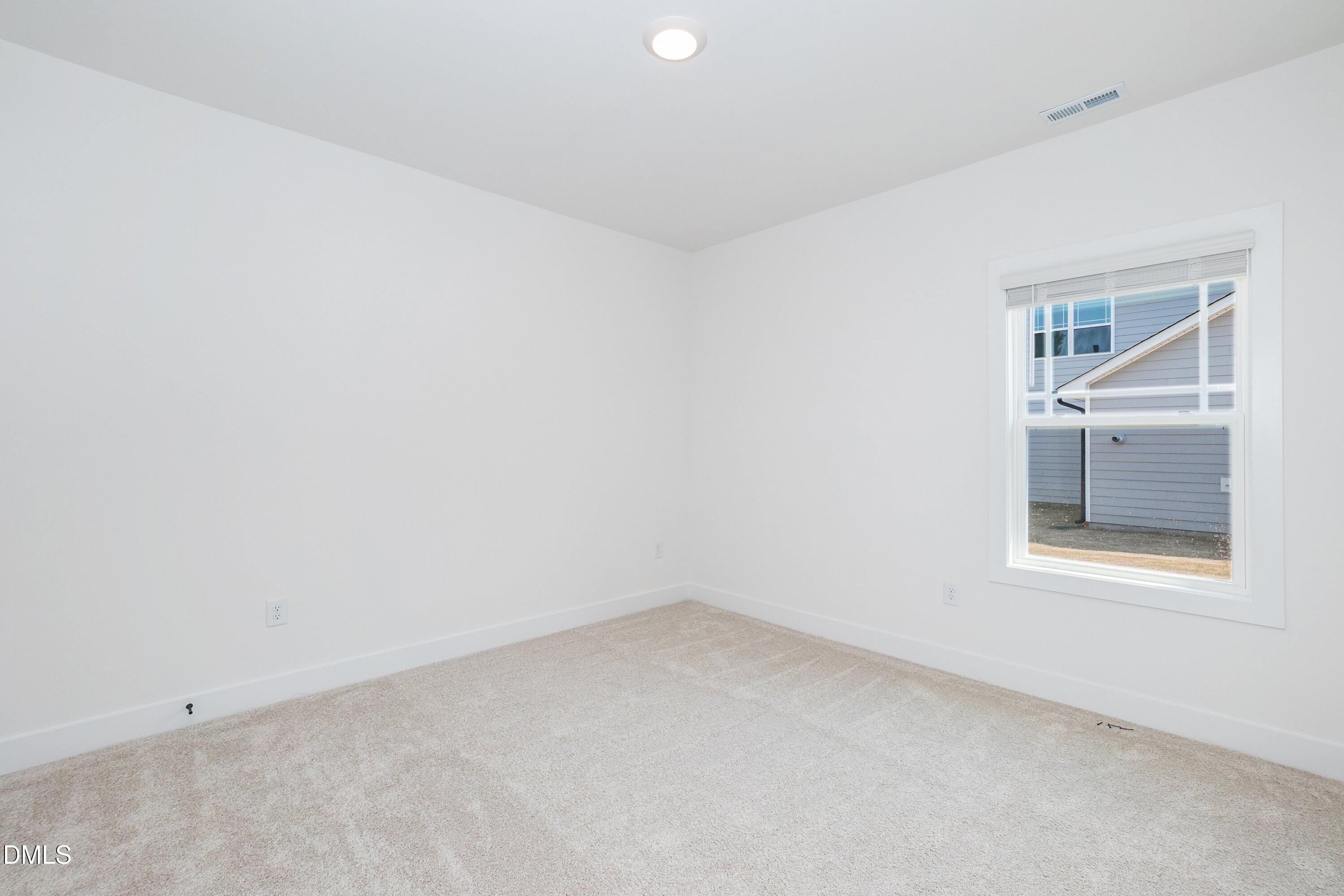 180 Galway Road Lillington, NC 27546 - Photo 29 of 41 an empty room with a window