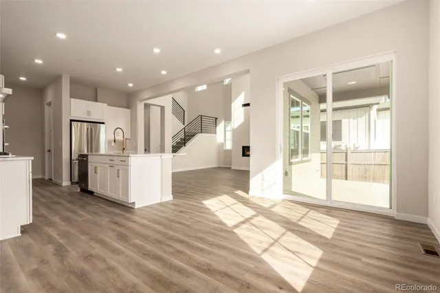 a view of a electric appliances and windows in a room
