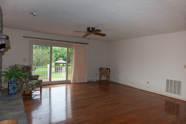 247 Craig Shop Road Mount Sidney, VA 24467 - Photo 3 of 17 a view of an empty room with a window and wooden floor