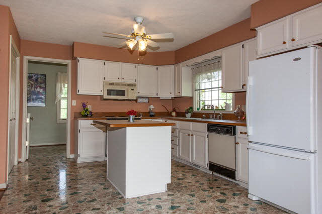 247 Craig Shop Road Mount Sidney, VA 24467 - Photo 4 of 17 a kitchen with a refrigerator and a sink