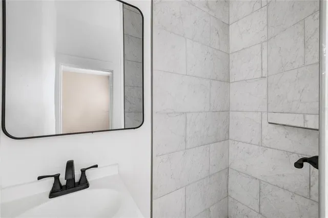 a bathroom with a sink and a mirror