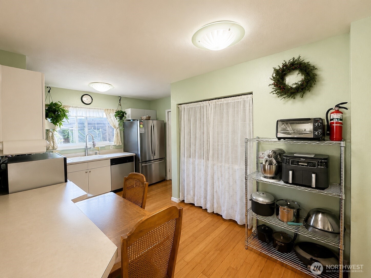 902 Harding Road Aberdeen, WA 98520 - Photo 4 of 18 a living room with stainless steel appliances furniture and a flat screen tv
