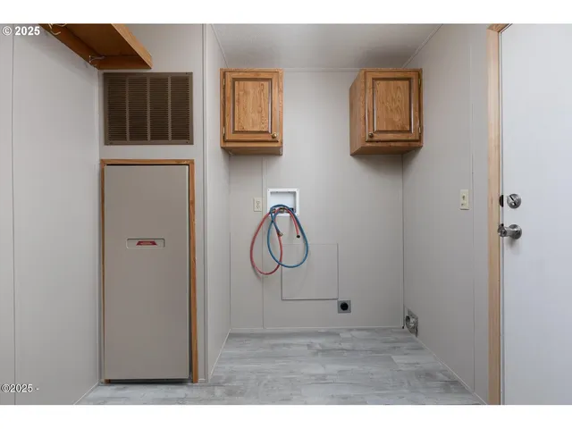 a picture of a room with wooden floor and wall