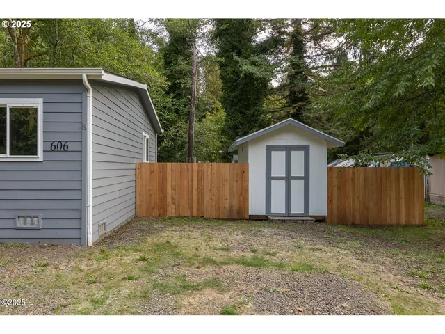 a view of front of a house with a yard and garage