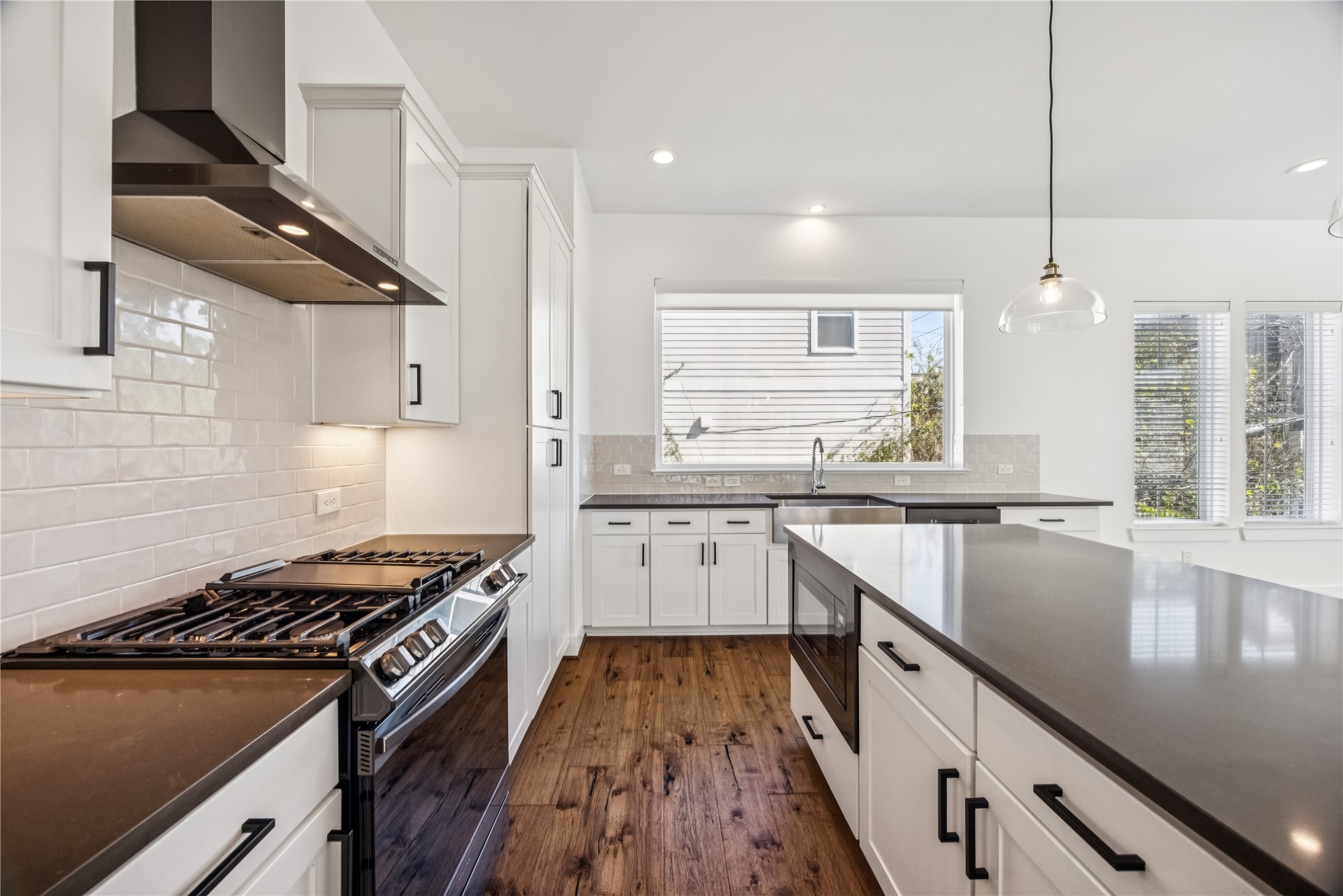 1812 West Webster Street Houston, TX 77019 - Photo 11 of 23 a kitchen with granite countertop a sink stove and cabinets