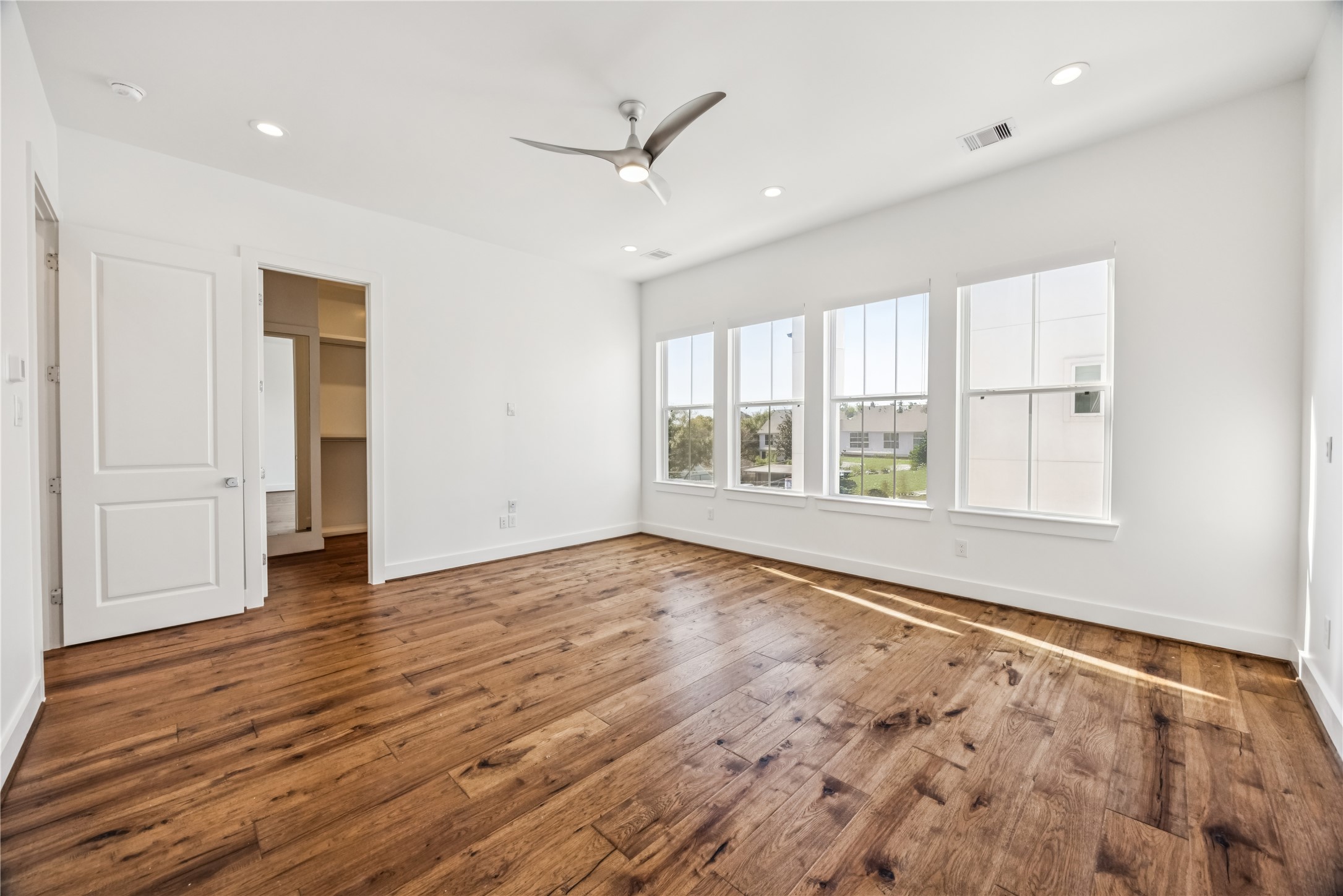 1812 West Webster Street Houston, TX 77019 - Photo 17 of 23 an empty room with wooden floor and windows