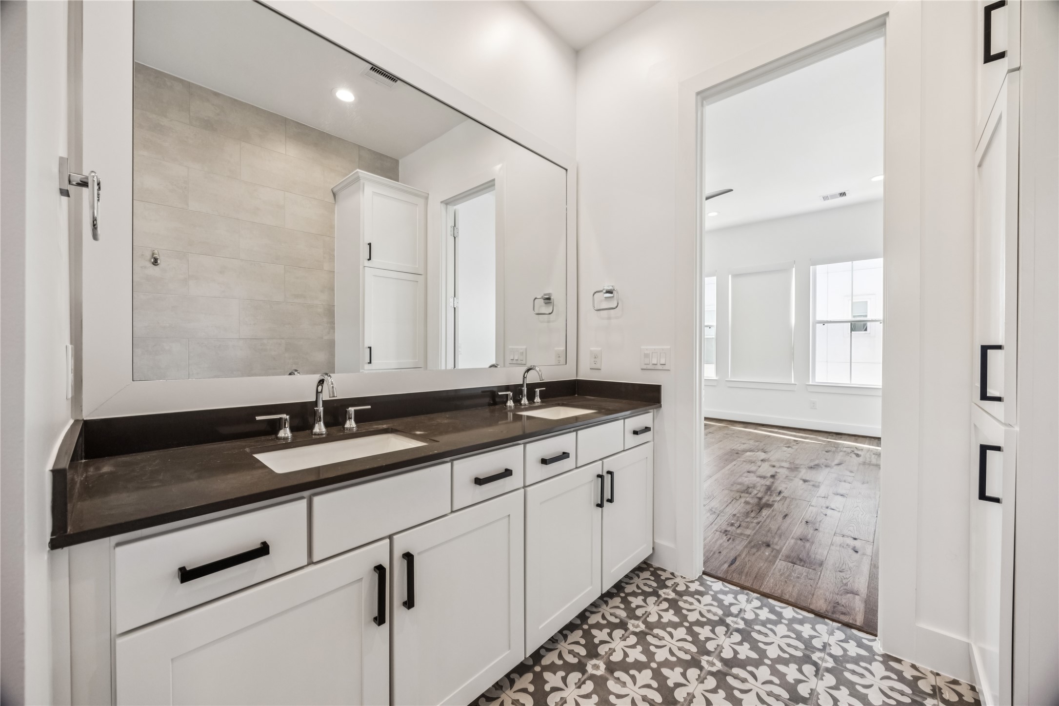 1812 West Webster Street Houston, TX 77019 - Photo 20 of 23 a bathroom with a granite countertop sink a mirror and a