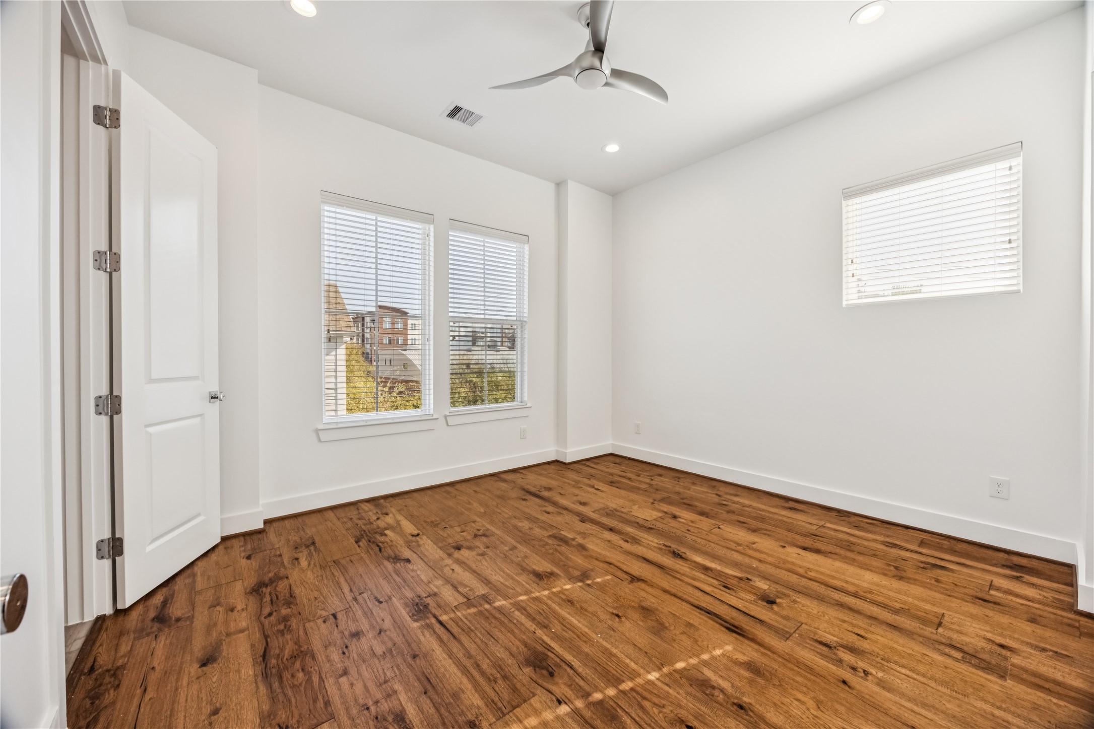 1812 West Webster Street Houston, TX 77019 - Photo 21 of 23 a view of empty room with wooden floor and fan