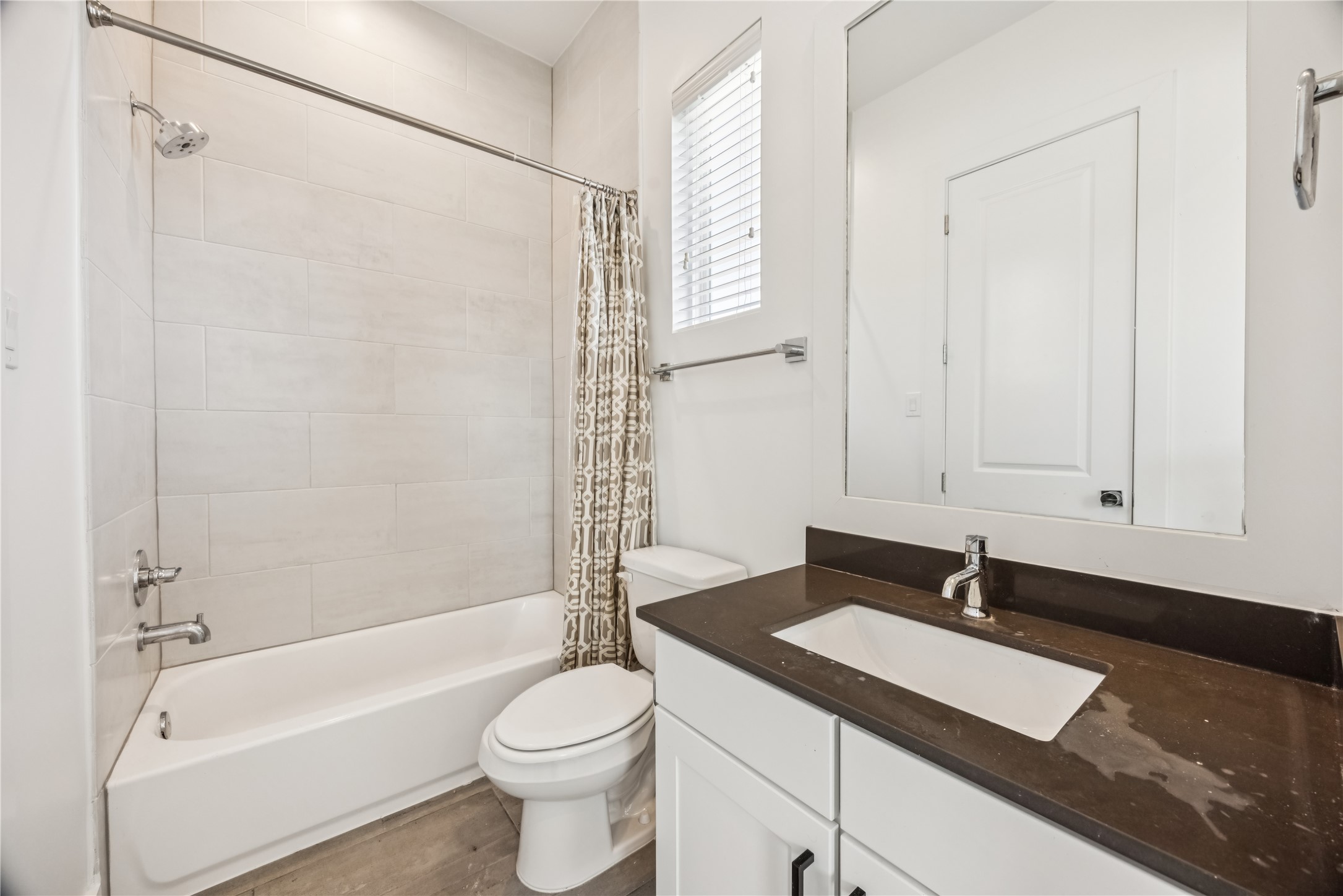 1812 West Webster Street Houston, TX 77019 - Photo 22 of 23 a bathroom with a sink a toilet and a bathtub