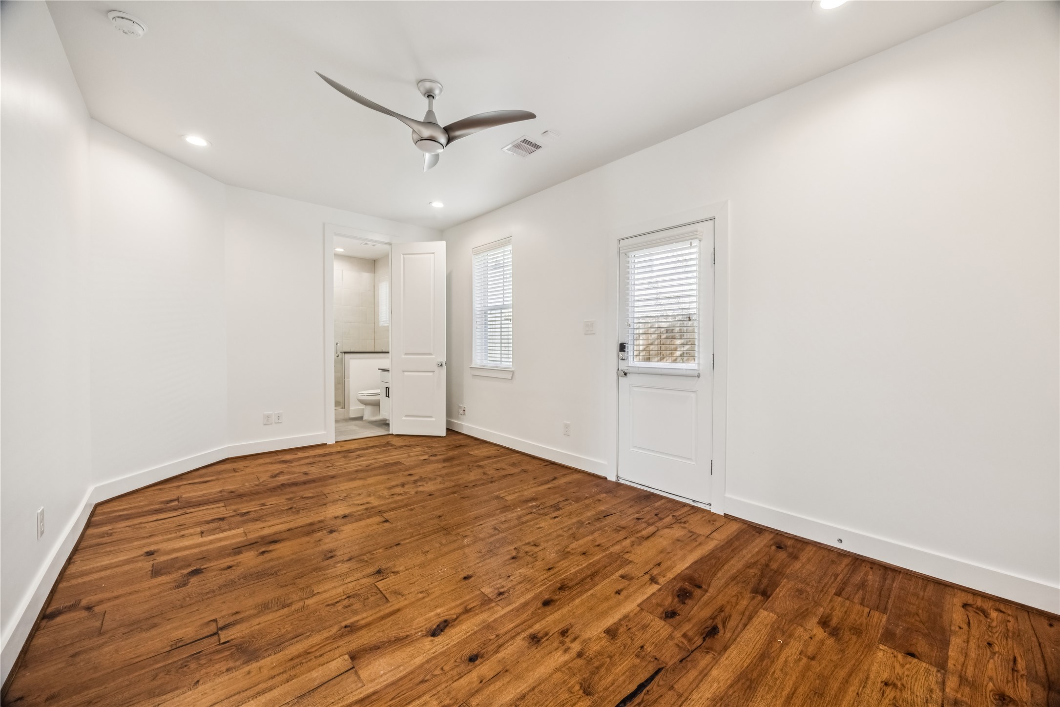 1812 West Webster Street Houston, TX 77019 - Photo 3 of 23 a view of empty room with wooden floor and fan