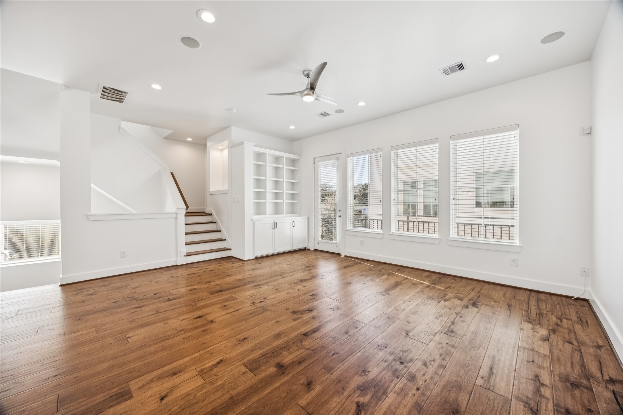 1812 West Webster Street Houston, TX 77019 - Photo 8 of 23 a view of an empty room with wooden floor and a window
