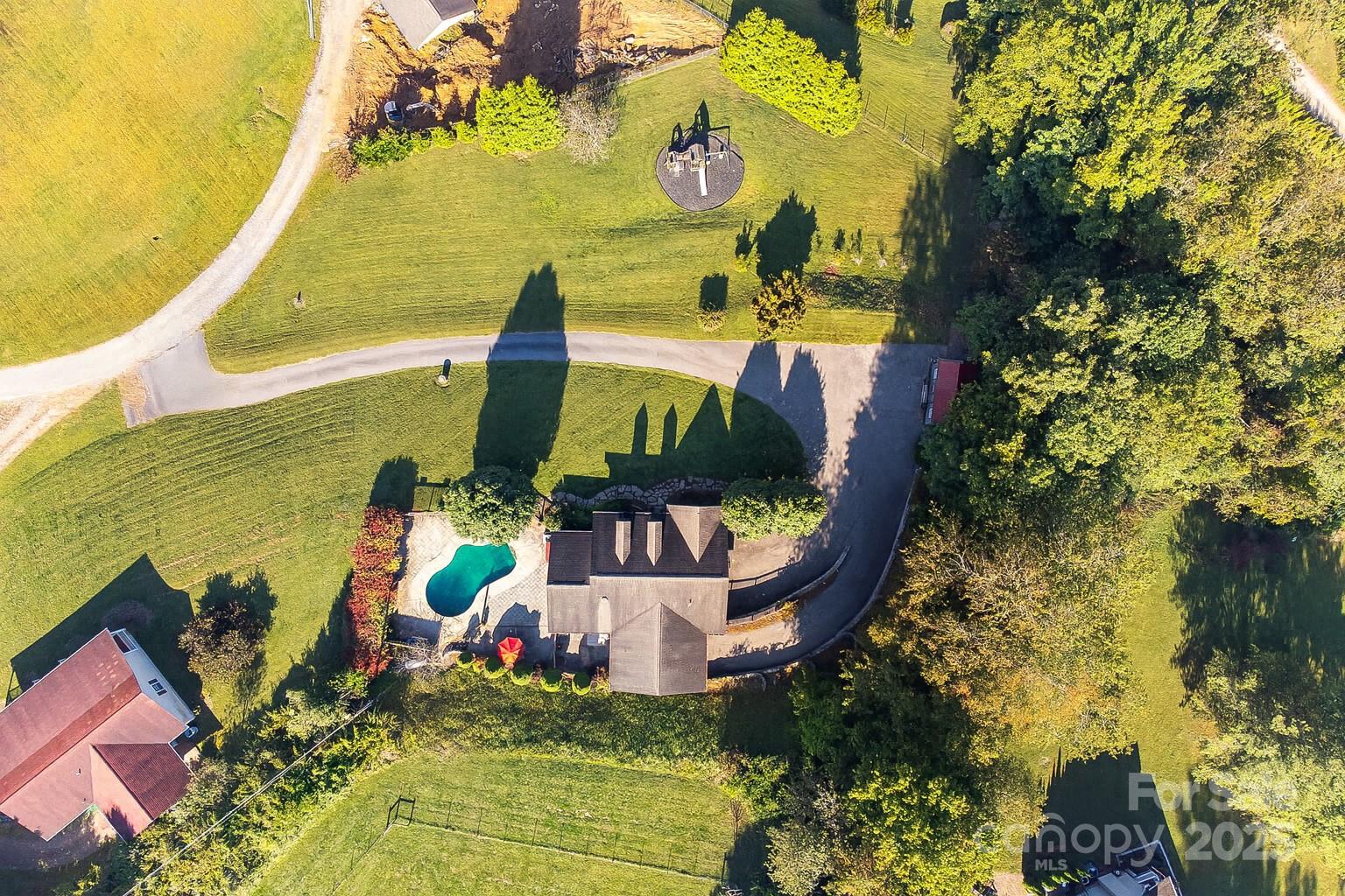 57 Stillwater Springs Road Burnsville, NC 28714 - Photo 2 of 48 a view of a swimming pool with a patio