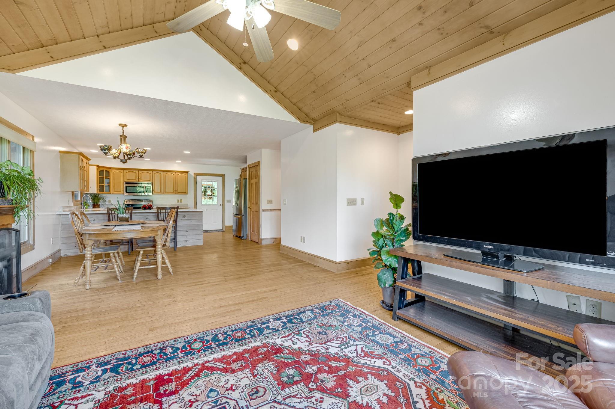 57 Stillwater Springs Road Burnsville, NC 28714 - Photo 23 of 48 a living room with furniture and a flat screen tv