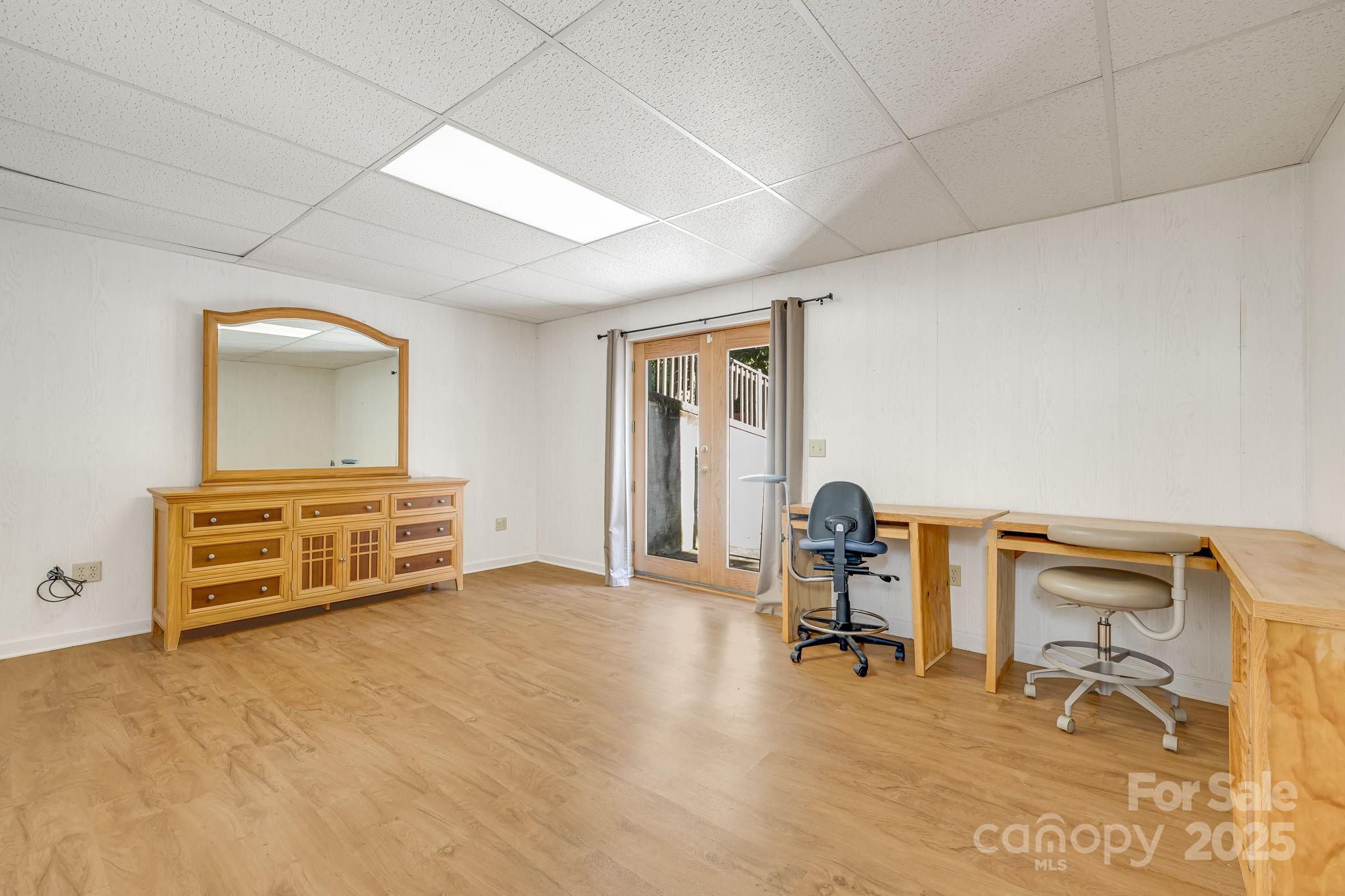 57 Stillwater Springs Road Burnsville, NC 28714 - Photo 41 of 48 a room with furniture and gym equipment