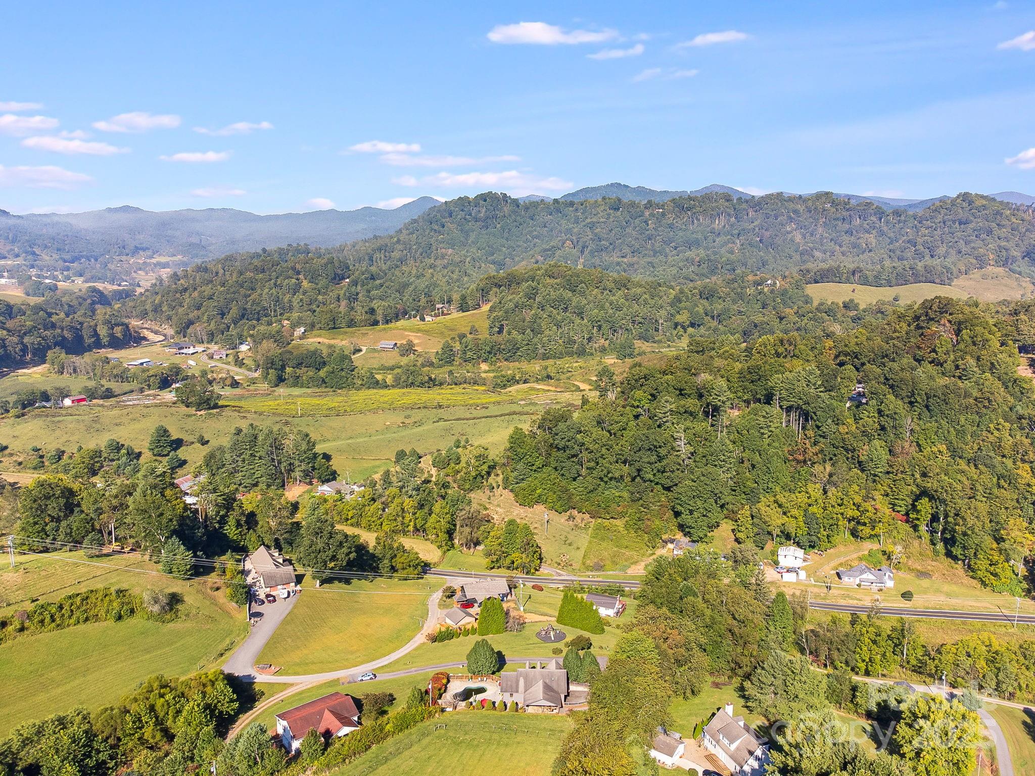 57 Stillwater Springs Road Burnsville, NC 28714 - Photo 47 of 48 a view of a city with mountains in the background