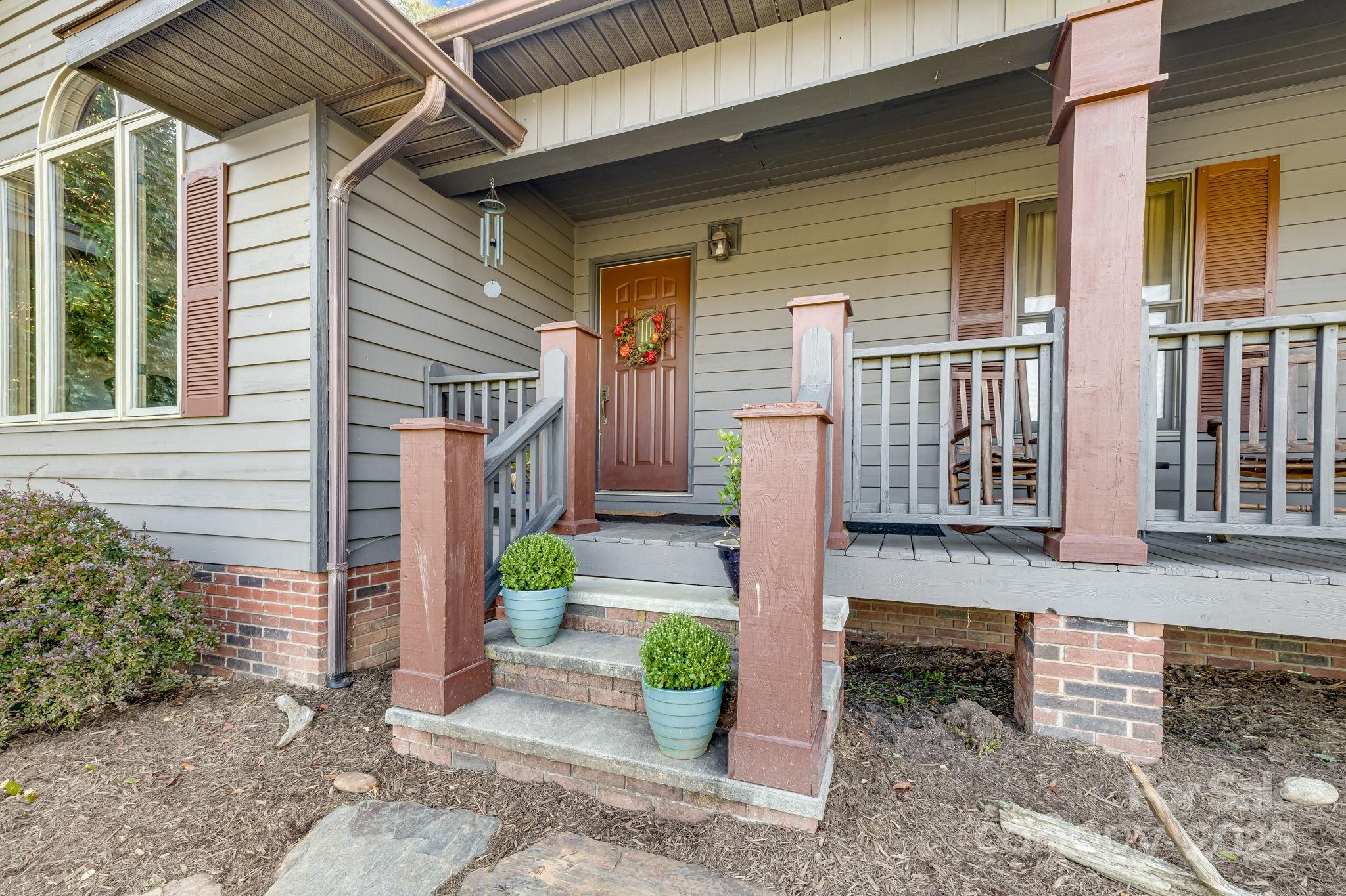 57 Stillwater Springs Road Burnsville, NC 28714 - Photo 10 of 48 a front view of a house with garden