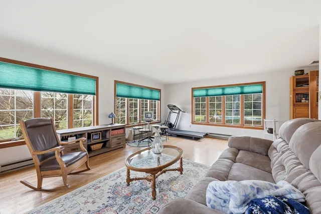 a view of a livingroom with furniture and stairs