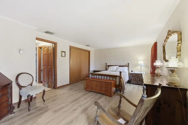 a living room with furniture and a dresser