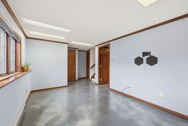 a room with furniture pool table and flat screen tv