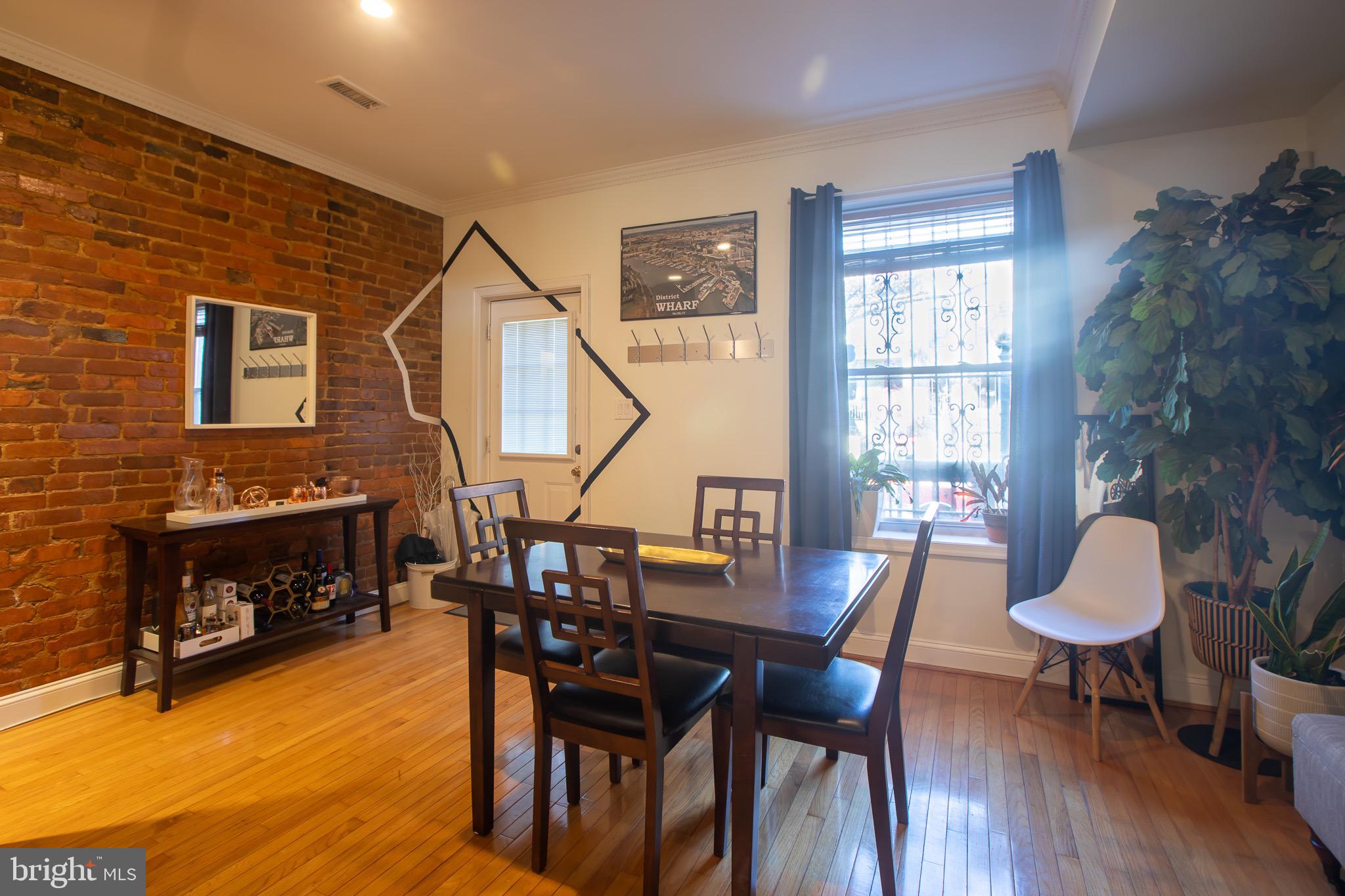 636 Columbia Road Northwest Washington, DC 20001 - Photo 11 of 60 a view of a livingroom with furniture and a fireplace