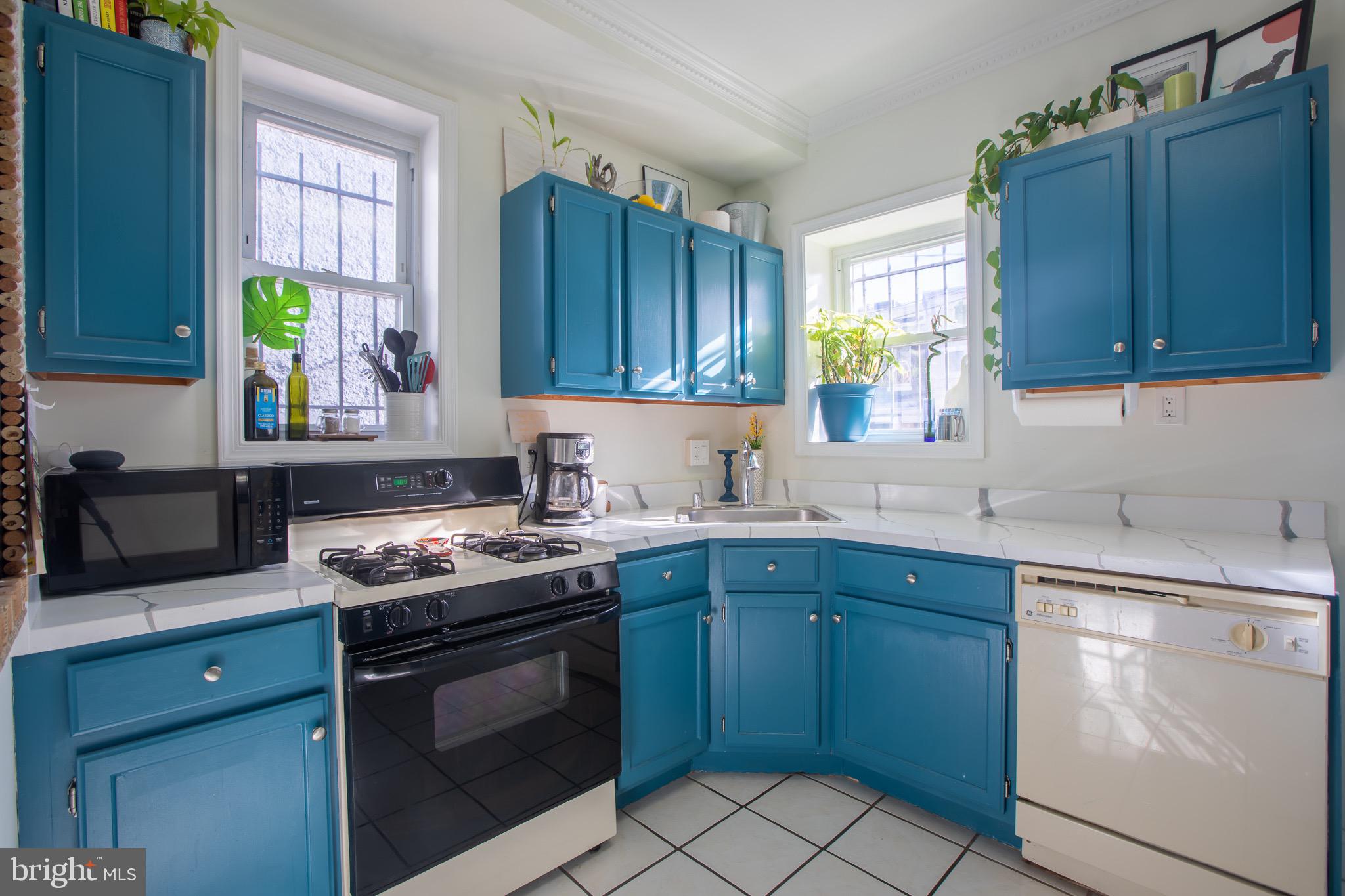 636 Columbia Road Northwest Washington, DC 20001 - Photo 20 of 60 a kitchen with a sink stove top oven and cabinets