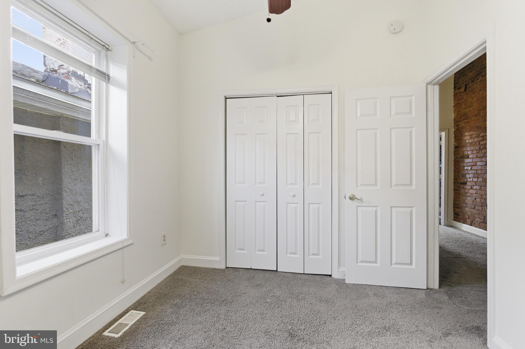 636 Columbia Road Northwest Washington, DC 20001 - Photo 27 of 60 an empty room with windows