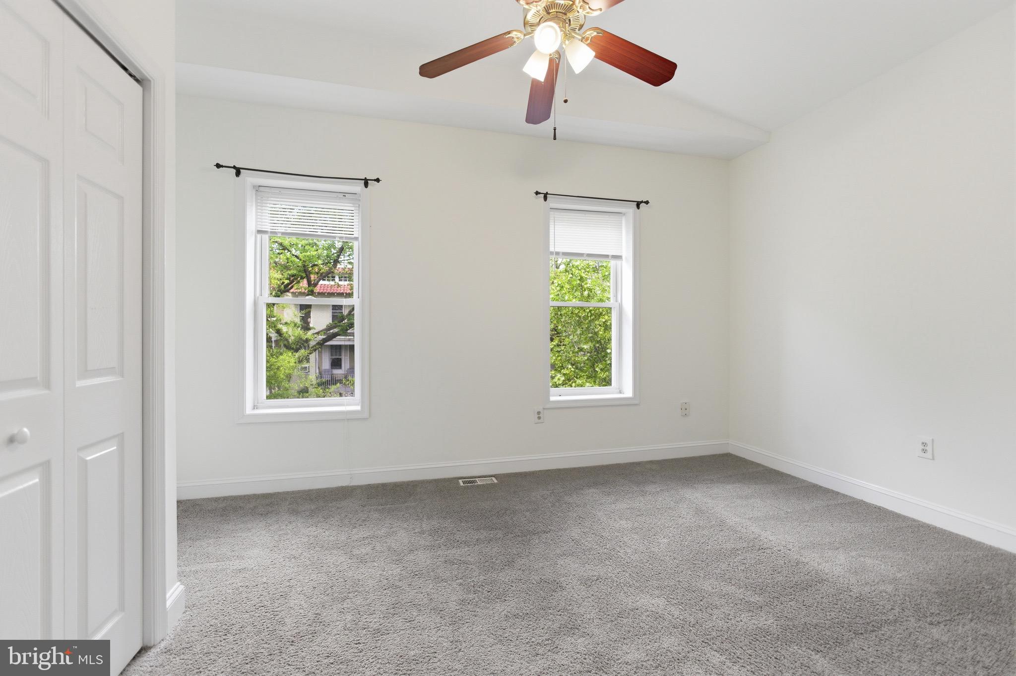 636 Columbia Road Northwest Washington, DC 20001 - Photo 29 of 60 an empty room with windows and fan