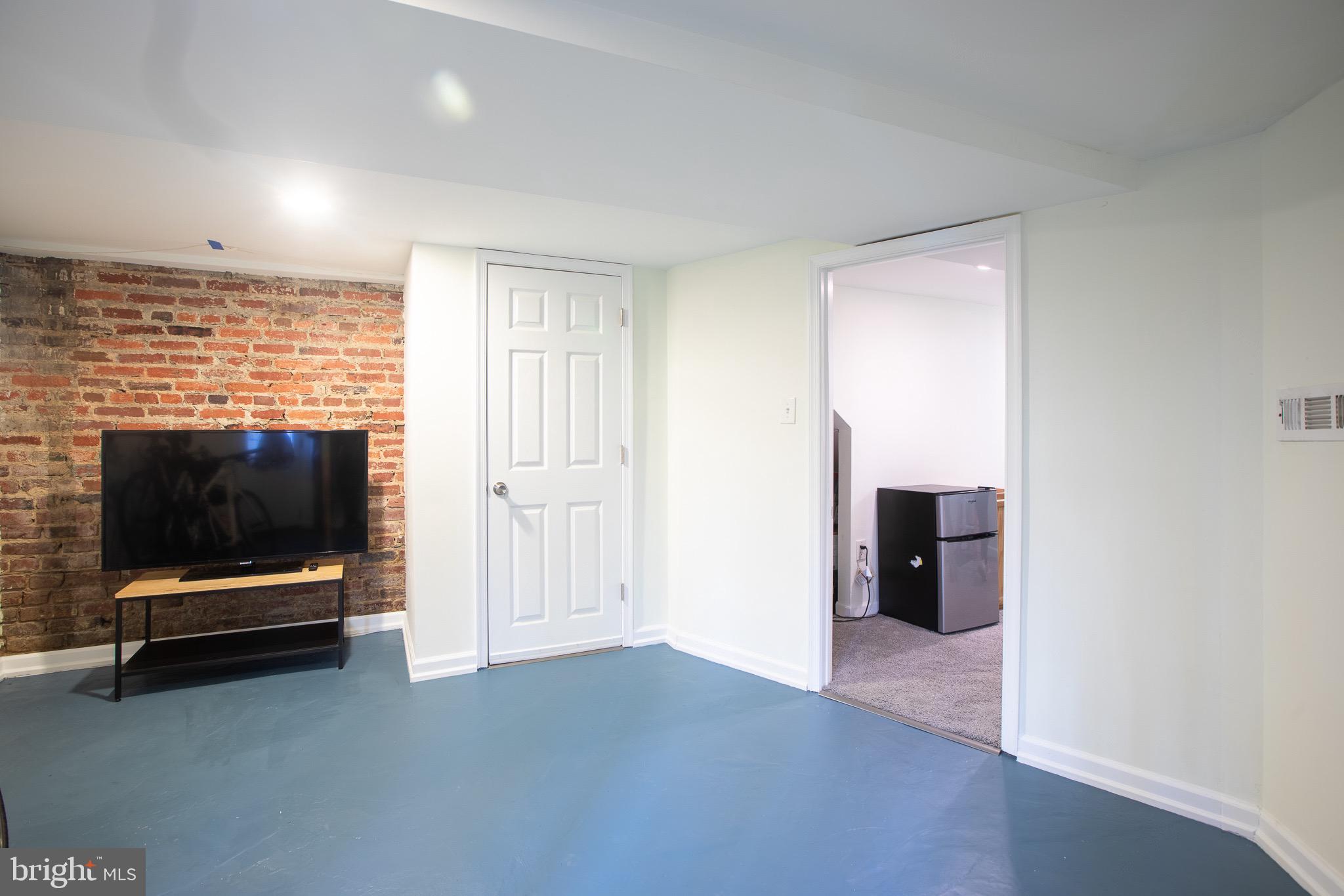 636 Columbia Road Northwest Washington, DC 20001 - Photo 40 of 60 a view of room with furniture and flat screen tv