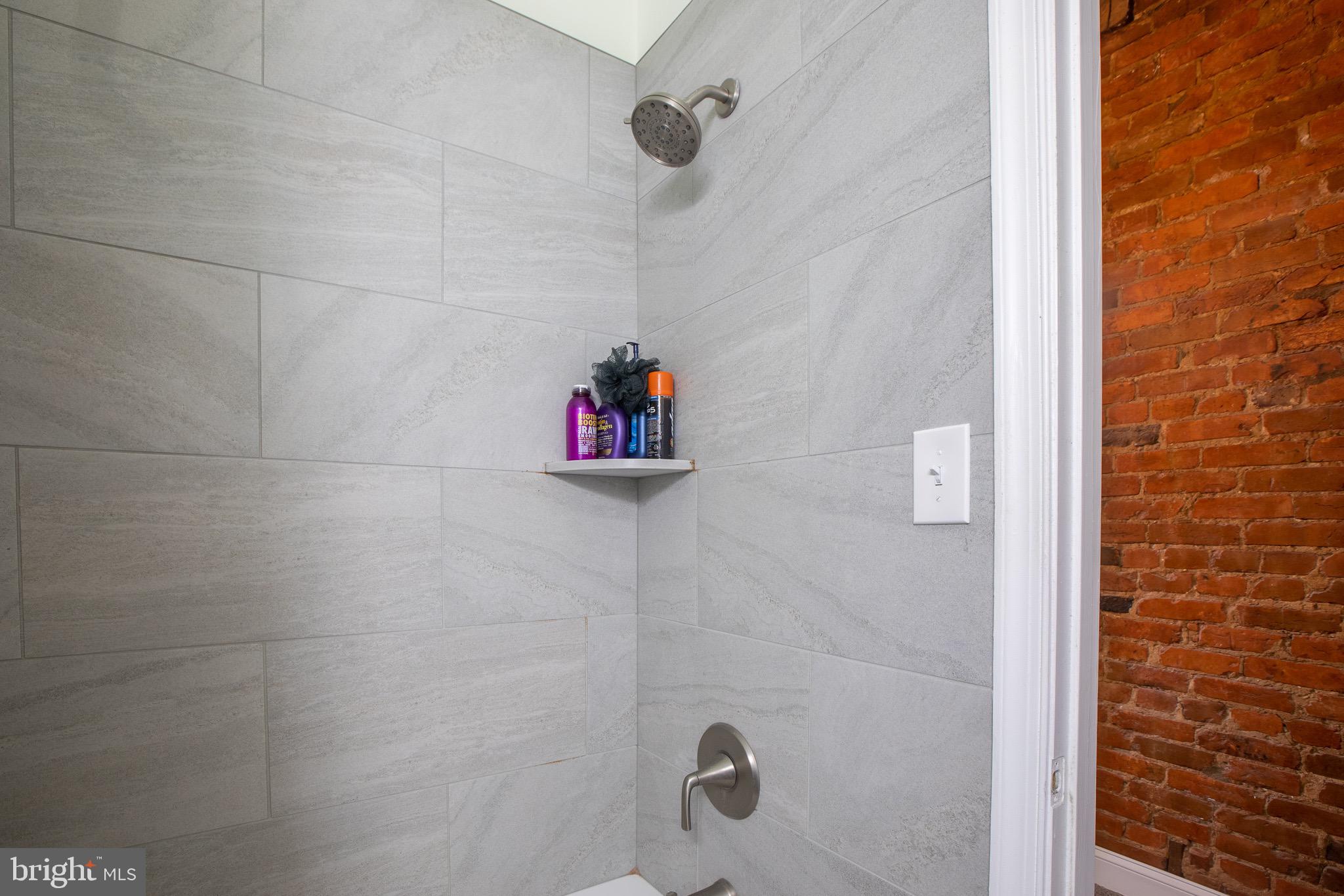 636 Columbia Road Northwest Washington, DC 20001 - Photo 51 of 60 a bathroom with a shower