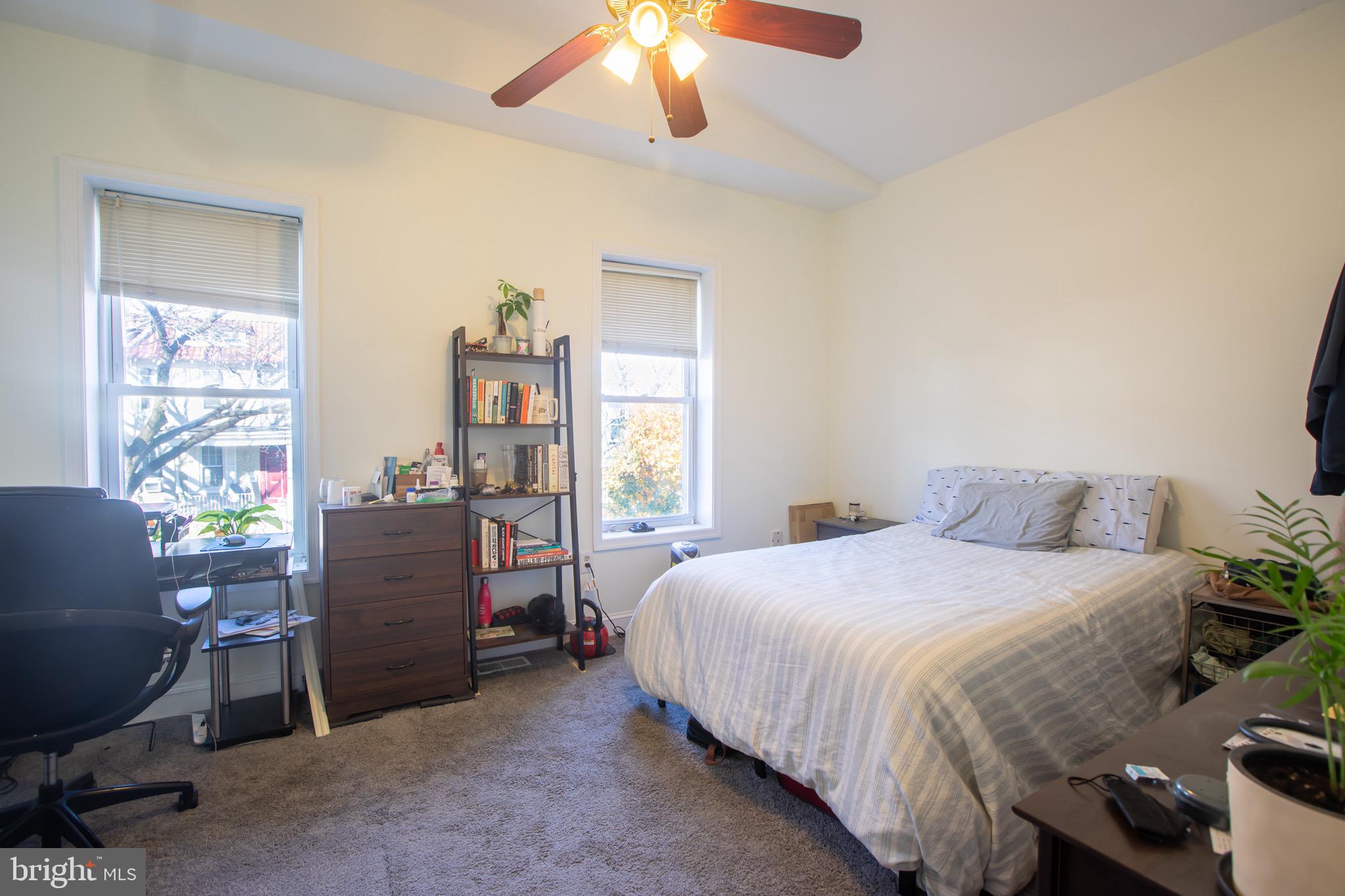 636 Columbia Road Northwest Washington, DC 20001 - Photo 53 of 60 a bedroom with a bed and a chandelier