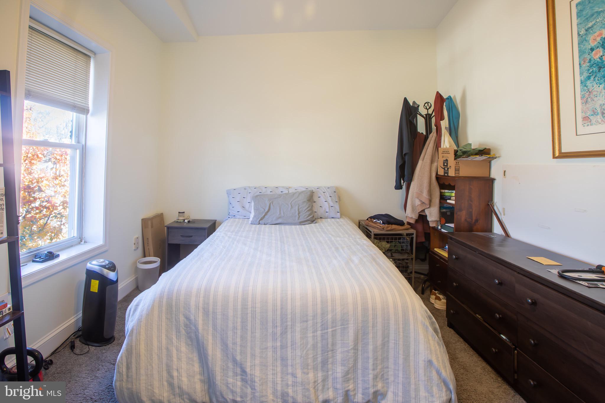 636 Columbia Road Northwest Washington, DC 20001 - Photo 54 of 60 a bed room with a bed and a window