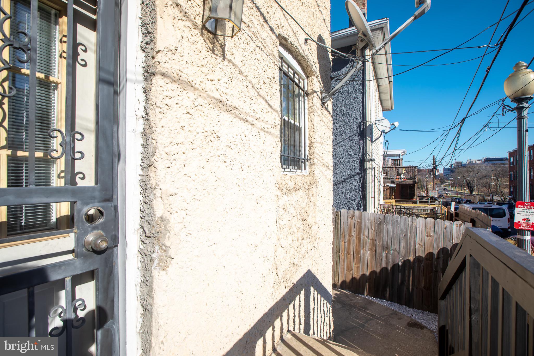 636 Columbia Road Northwest Washington, DC 20001 - Photo 58 of 60 a view of a balcony with wooden fence