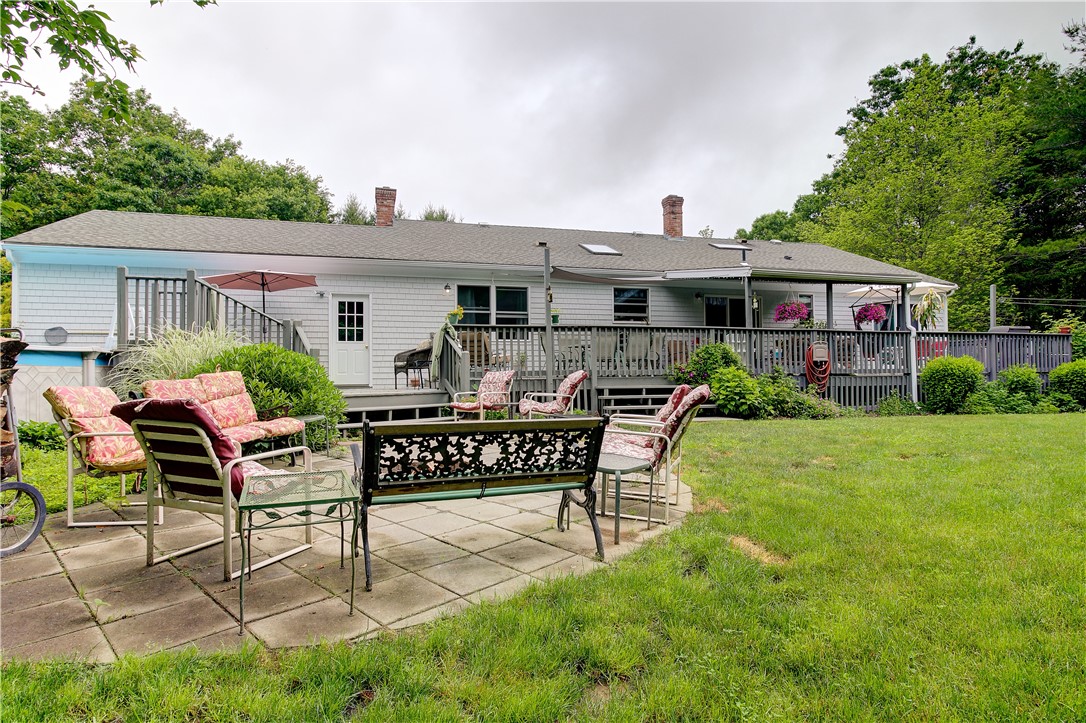 50 Sheffield Hill Road Exeter, RI 02822 - Photo 3 of 50 Back Exterior Firepit Area and Expansive Lawn
