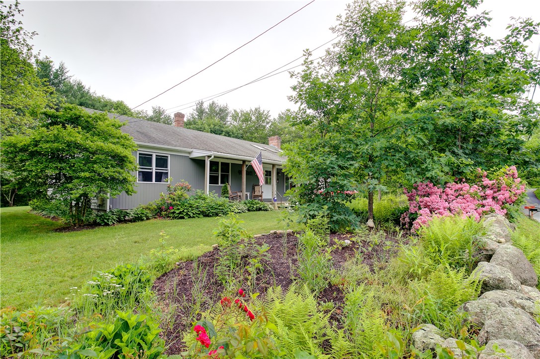 50 Sheffield Hill Road Exeter, RI 02822 - Photo 5 of 50 Extensive Flower Garden in Front Yard